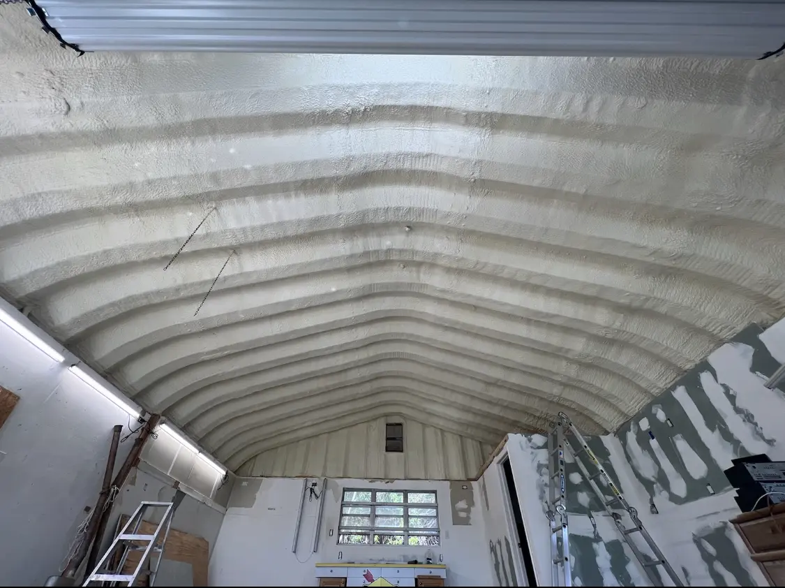 Spray polyurethane foam applied to the underside of a metal roof deck in East Allen